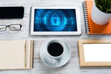 Web security and technology concept with tablet pc on wooden table