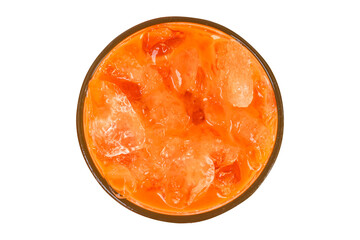 Iced milk tea color orange with crushed ice in glass on top corner. Refreshing drink is popular in tropical countries. Isolated on cut out PNG.	Packed with old fashioned bags.