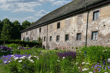 ancient cloister in europe with kitchen garden in front