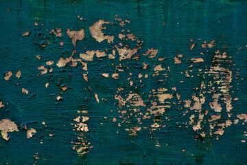 Wall with peeling green blue paint, cracked plaster, cracks, texture for mock up. Rustic old red surface. Empty background