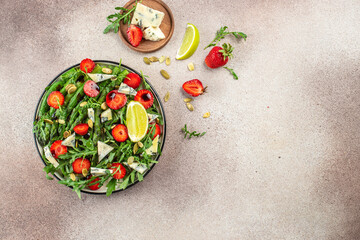 Summer Fruit Vegan Strawberry Salad on a light background. place for text, top view