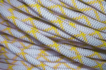 Climbing white and yellow rope as a texture, pattern, background