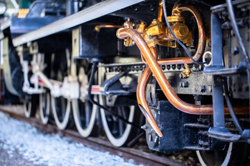 Selective focus to copper or brass pipes for venting steam pressure on steam locomotives. Vintage...
