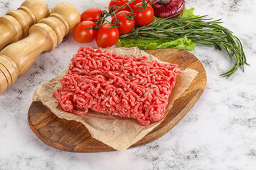 Raw minced beef meat on cutting board