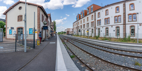 Obraz premium Obernai, France - 06 23 2023: Obernai train station. View of a railway line near the train station .
