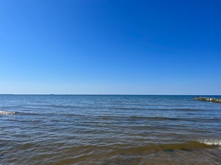 Fototapeta na wymiar Blue seascape, sea coast, clear blue sky