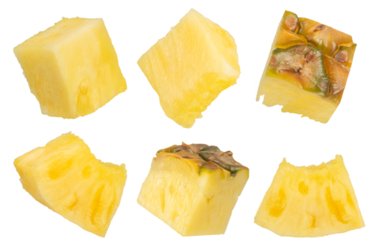 Pieces of pineapple on a white isolated background. Juicy pineapple cut into pieces of different sizes and shapes. Isolate of pineapple pieces with the remnants of the peel on different sides.