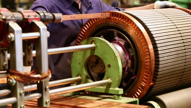 Huge copper electric motor of train production in a factory.