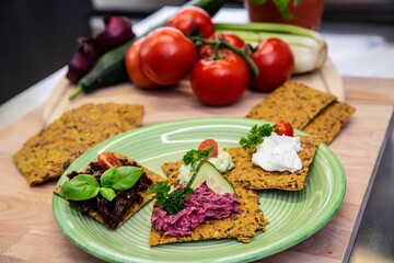 Plate of freshly-baked crispbread with various toppings.