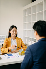 Salesman Hands On House Model , Small Toy House Small Mortgage Property insurance and concepts real estate.