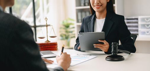 business people and lawyers discussing contract papers sitting at the table. Concepts of law, advice, legal services.