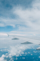 Aeroplane or aircraft wings with beautiful scenery blue sky