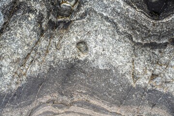 Closeup shot of a natural gray stone pattern.