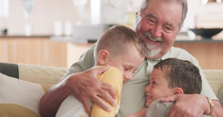 Family, love and grandchildren hugging their grandfather while sitting on a sofa in the living room of their home together. Smile, excited and kids embracing their senior male grandparent in a house - Powered by Adobe