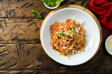 Homemade pasta with tomato and cheese