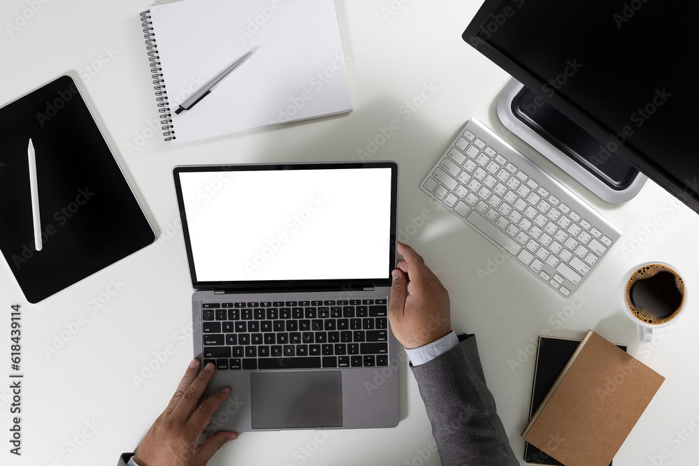 Wall mural men using laptop computer working at office workspace with blank display white desktop screen monito