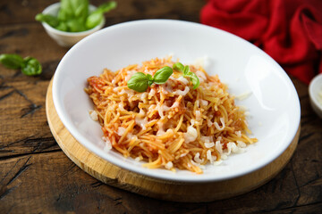 Homemade pasta with tomato and cheese