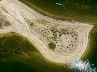 Aerial view over a large sandbar in the green waters of Oyster Bay in Lloyd Harbor on Long Island
