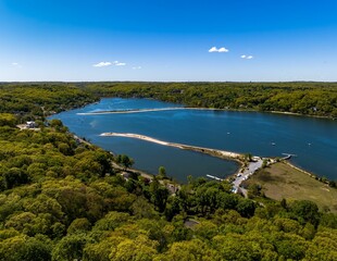 Aerial view over a large sandbar in the green waters of Oyster Bay in Lloyd Harbor on Long Island