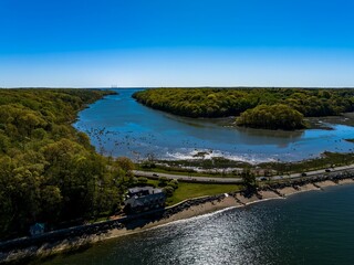 Fototapeta premium Aerial shot over West Neck Beach on Long Island in the suburb of Lloyd Harbor New York on sunny day