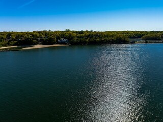 Aerial view over the calm waters in Oyster Bay near Lloyd Harbor, New York on a sunny day