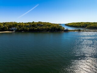 Aerial view over the calm waters in Oyster Bay near Lloyd Harbor, New York on a sunny day