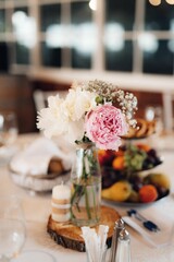 Beautiful wedding table setup with vibrant floral decorations.