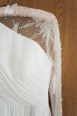 Closeup shot of the details of a wedding dress.