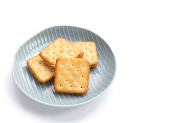 Biscuits in plate on white background.