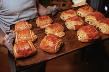 there are many croissants being made on a tray