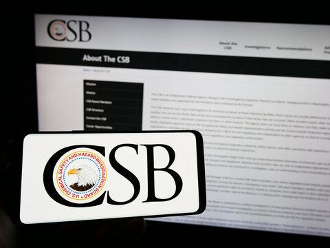 Stuttgart, Germany - 06-18-2023: Person holding cellphone with logo of American federal agency USCSB on screen in front of webpage. Focus on phone display.
