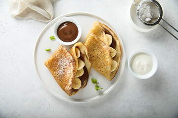 Homemade crepes with chocolate paste