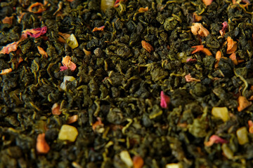 Loose Leaf Mango Pineapple Fruit Tea Wallpaper. Mix Black and Green Dry Tea Leaves. Close Up,...