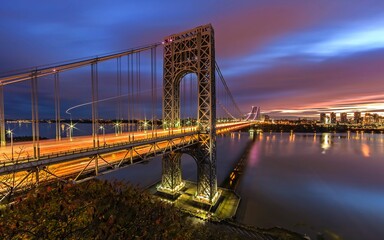 Aerial long exposure shot of the George Washington Bridge with car trails at sunset