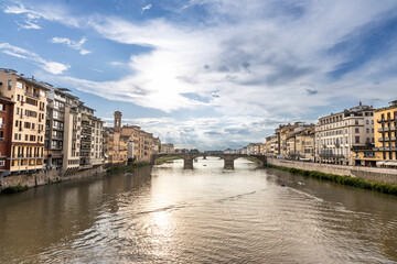 Fototapeta na wymiar Walkway along Arno river in Florence Italy is popular route to appreciate the attractions offered on both sides of the river