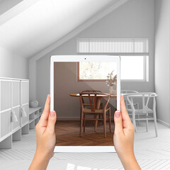 Augmented reality concept. Hand holding tablet with AR application used to simulate furniture and design products in total white unfinished background, japandi minimal dining room