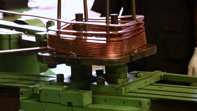Copper wire folding on a square roll.
