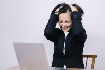 Young beautiful business woman stressed from office work Use your hands to ruffle your hair until it's a mess.