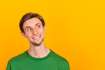 Photo of young cheerful good mood smile brunet hair stubble guy wear blue sweater smile look up cheap prices isolated on yellow color background