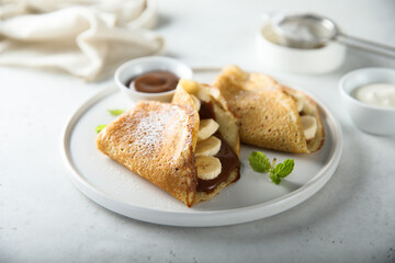 Homemade crepes with chocolate paste