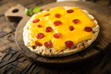 Homemade pita pizza with sausage