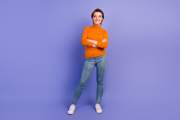 Full body studio photo of young happy confident woman hands crossed isolated on lilac color background