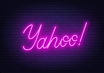 Yahoo neon sign on brick wall background.