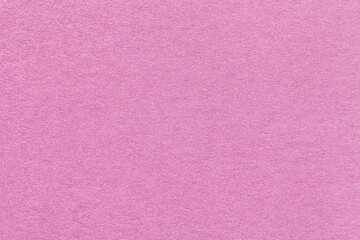 Texture of craft lilac and rose paper background, macro. Structure of vintage dense kraft pink cardboard.