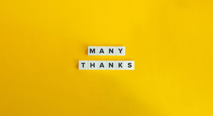 Many thanks Phrase on Block Letter Tiles on Yellow Background. Minimal Aesthetic.