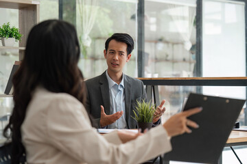 Two businessmen discussing some documents company. Group business making plans together