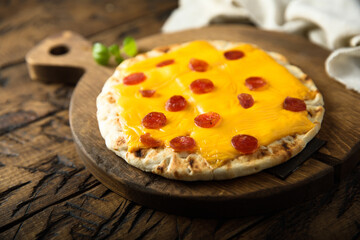 Homemade pita pizza with sausage