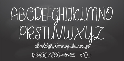 Fototapeta na wymiar Set of retro hand drawn alphabet letters drawing with white chalk on chalkboard