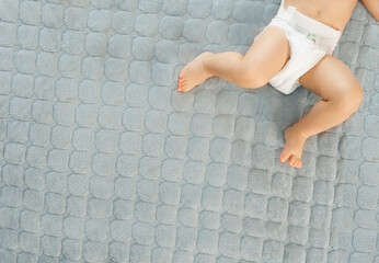 Baby legs on changing mat