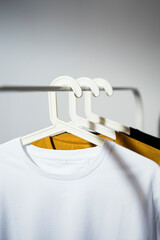  T-shirts displayed on clothes rack